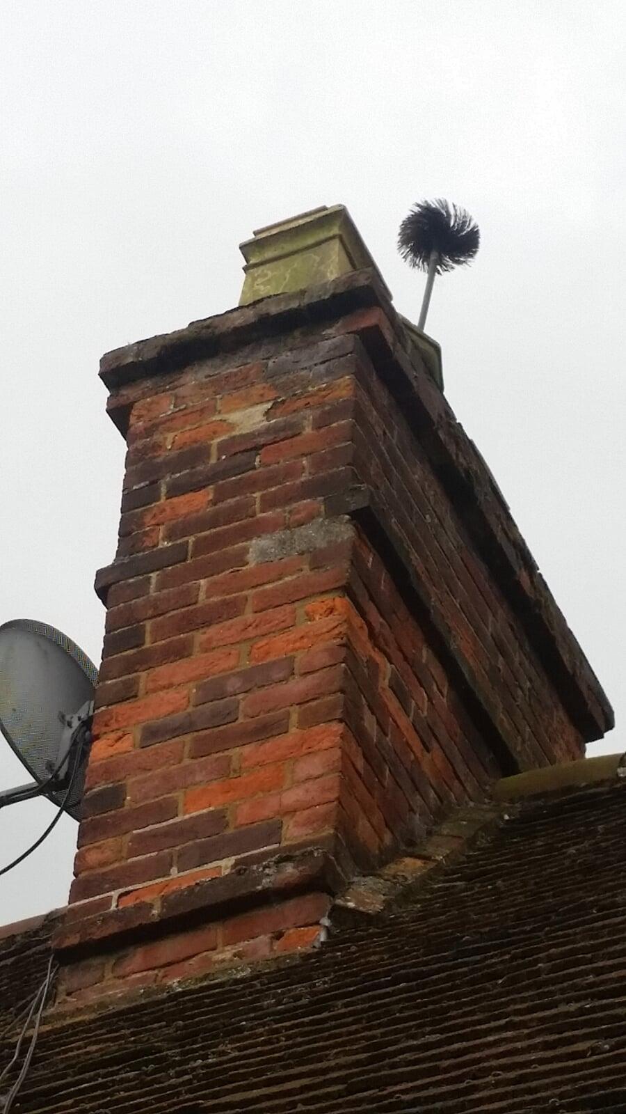 The brush needs to be stick out of the top during a chimney sweep