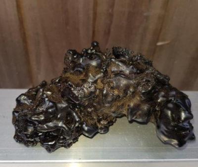 Solid deposit of crystalised tar created from soot whilst in chimney found in Codicote